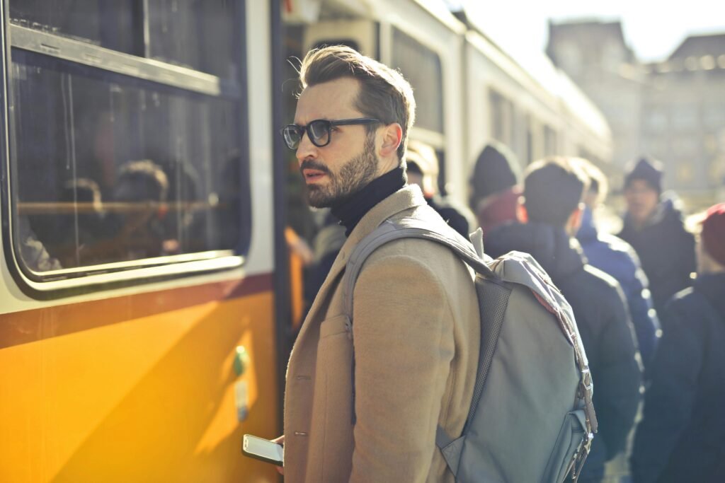 Social Media Marketing for Restaurants – 15 Tips With Examples A stylish man with a backpack boards a tram in bustling Budapest, Hungary, during the day.